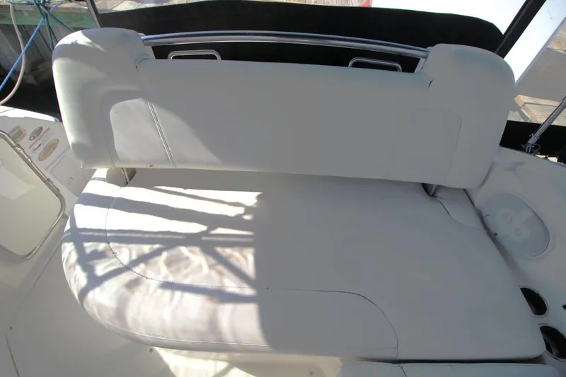 Slide: The Image of 2008 Maxum 2900 SE boat interior with white cushioned seating. - 17