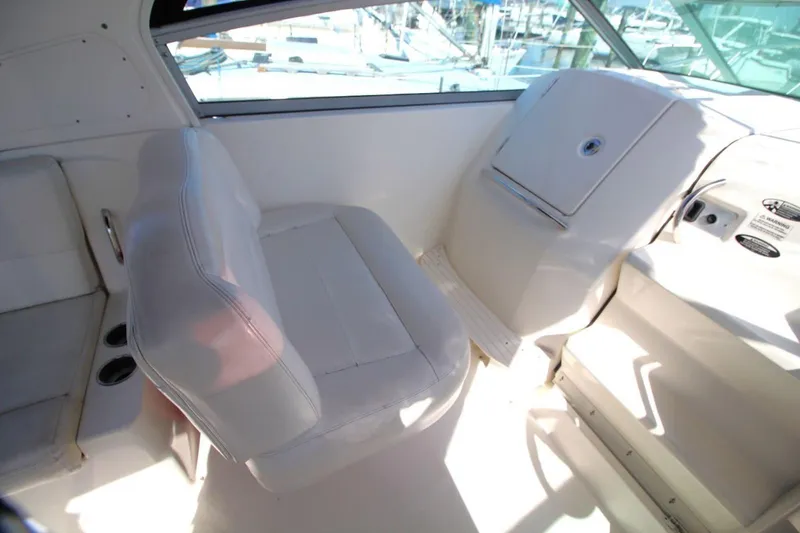 Slide: The Image of 2008 Maxum 2900 SE boat interior with white seating and dashboard. - 18