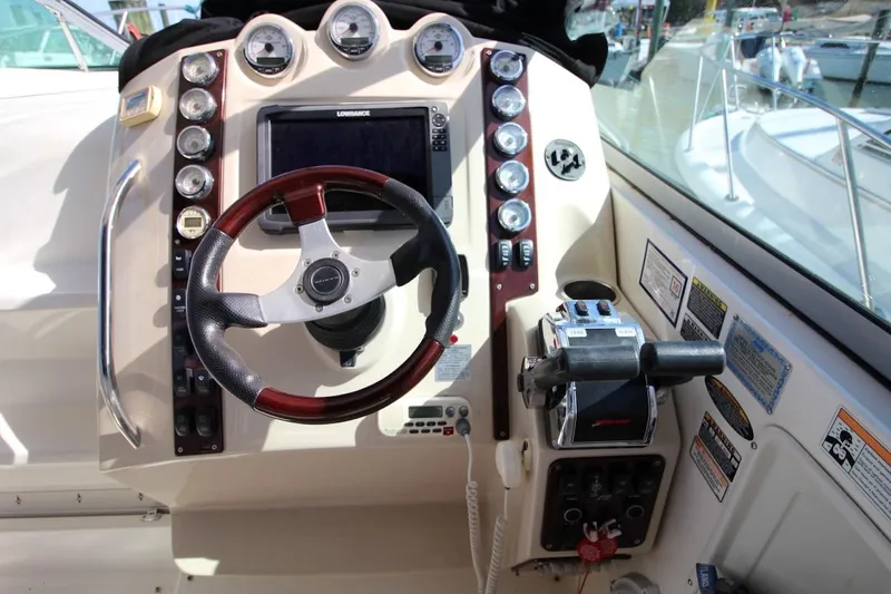 Slide: The Image of 2008 Maxum 2900 SE boat dashboard with steering wheel and control panel. - 20