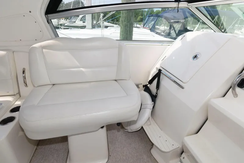Slide: The Image of 2008 Maxum 2900 SE boat interior with white seating and helm area. - 22