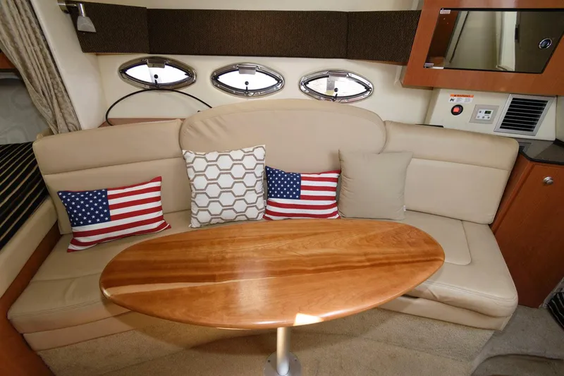 Slide: The Image of Cozy interior of 2008 Maxum 2900 SE with plush seating and decorative pillows. - 27