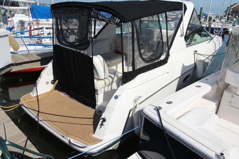 Slide: The Image of 2008 Maxum 2900 SE boat docked with black canopy and spacious deck. - 3