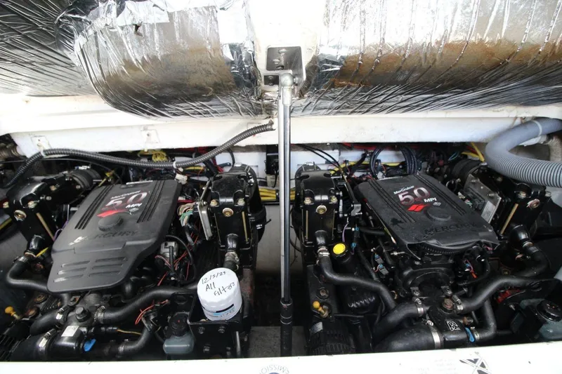 Slide: The Image of Twin MerCruiser engines in a 2008 Maxum 2900 SE boat engine compartment. - 34