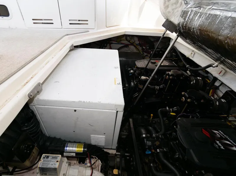 Slide: The Image of Engine compartment of a 2008 Maxum 2900 SE boat, showcasing mechanical components. - 37