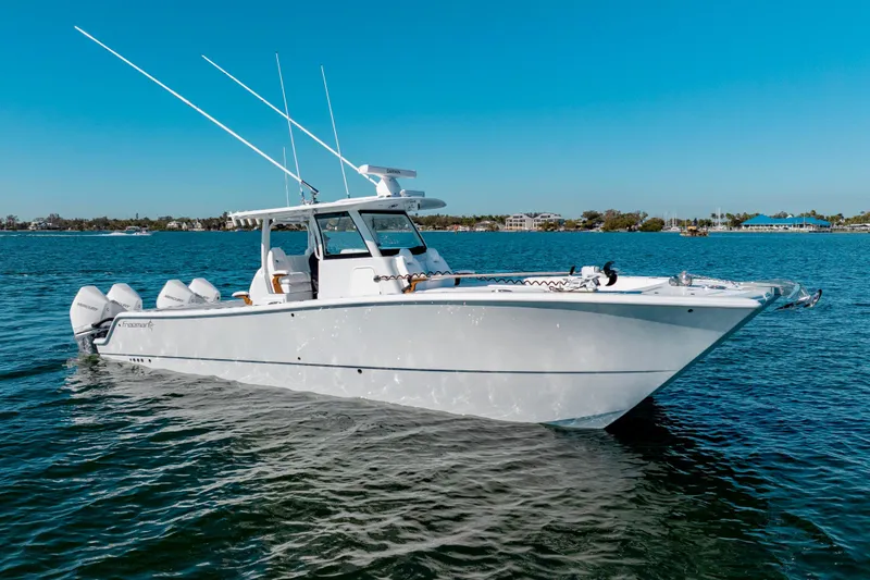 The Image of 2026 Freeman 35 boat on clear blue water, showcasing sleek design and powerful engines. - 1