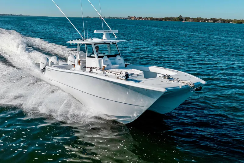 Slide: The Image of 2026 Freeman 35 boat cruising on open water, showcasing sleek design and powerful performance. - 13