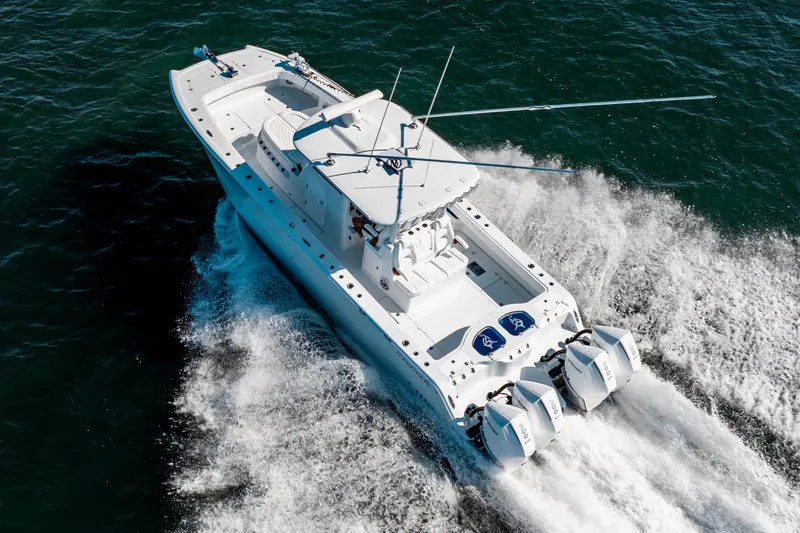 Slide: The Image of 2026 Freeman 35 boat cruising on open water with powerful engines. - 15