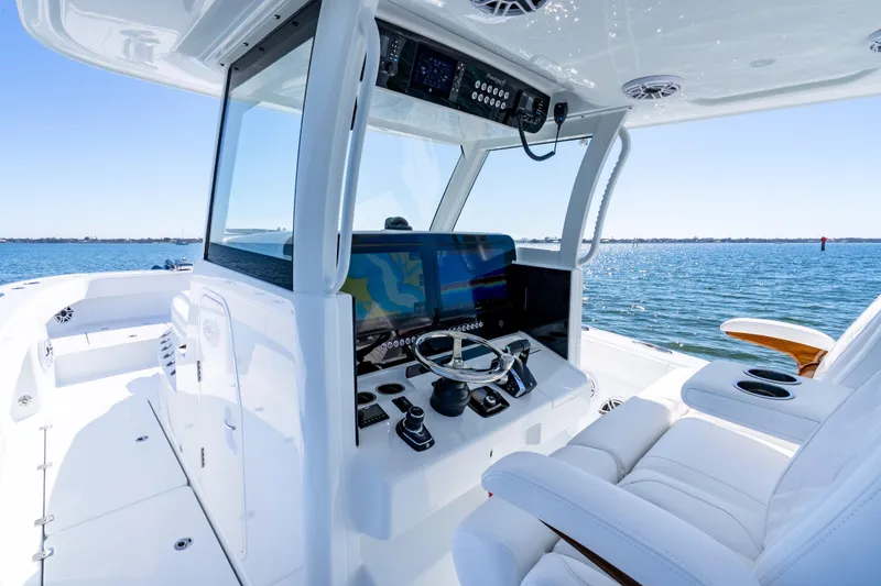 Slide: The Image of Luxurious 2026 Freeman 35 boat cockpit with advanced navigation system on open water. - 18