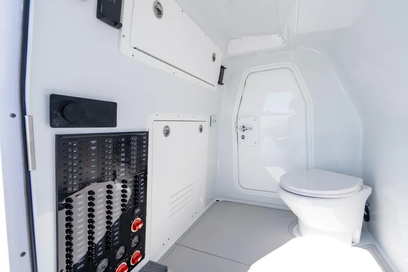Slide: The Image of Interior of Freeman 35 (2026) boat featuring a modern marine toilet and control panel. - 20