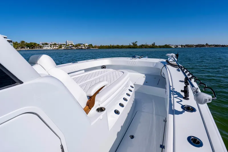 Slide: The Image of 2026 Freeman 35 boat on calm water, showcasing sleek design and luxurious seating. - 25