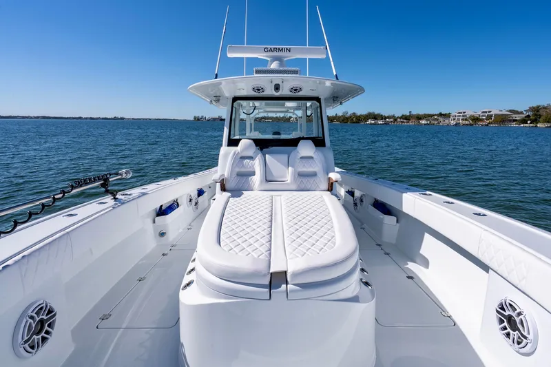 Slide: The Image of 2026 Freeman 35 boat with luxurious seating on a calm blue sea. - 27