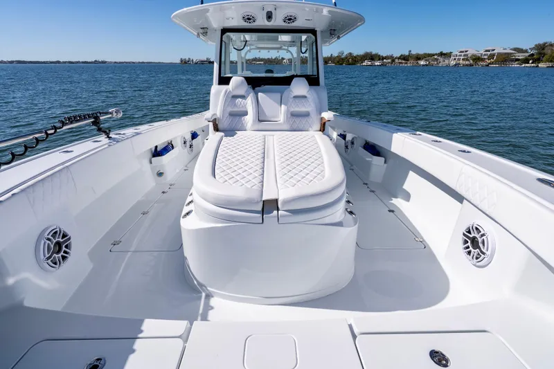 Slide: The Image of 2026 Freeman 35 boat interior with white seating, on calm water. - 28