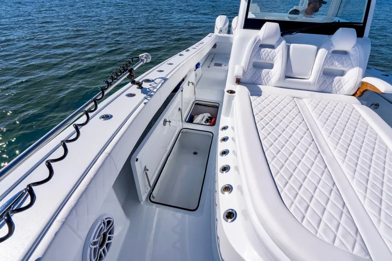 Slide: The Image of Luxurious 2026 Freeman 35 boat interior with white seating and storage compartments. - 30