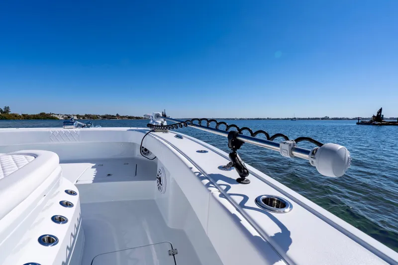 Slide: The Image of 2026 Freeman 35 boat on calm water under clear blue sky. - 32