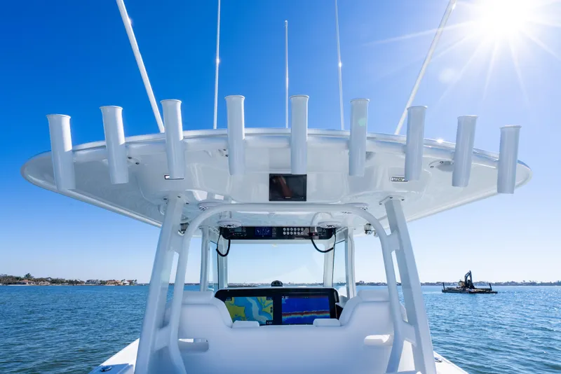 Slide: The Image of Freeman 35 boat helm with rod holders, sunny day, 2026 model. - 36