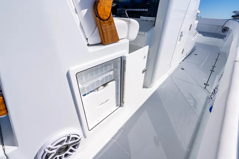 Slide: The Image of 2026 Freeman 35 boat interior with storage compartment and seating area. - 38