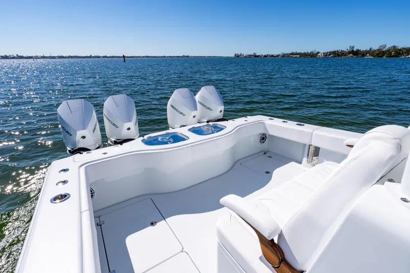 Slide: The Image of 2026 Freeman 35 boat with four Mercury engines on a sunny day at sea. - 39