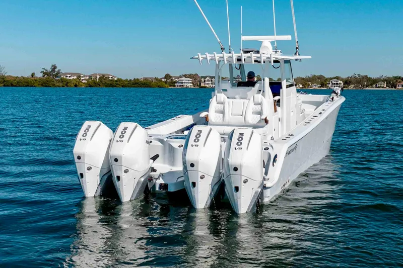 Slide: The Image of 2026 Freeman 35 boat with four 300 V8 engines on a calm blue sea. - 4