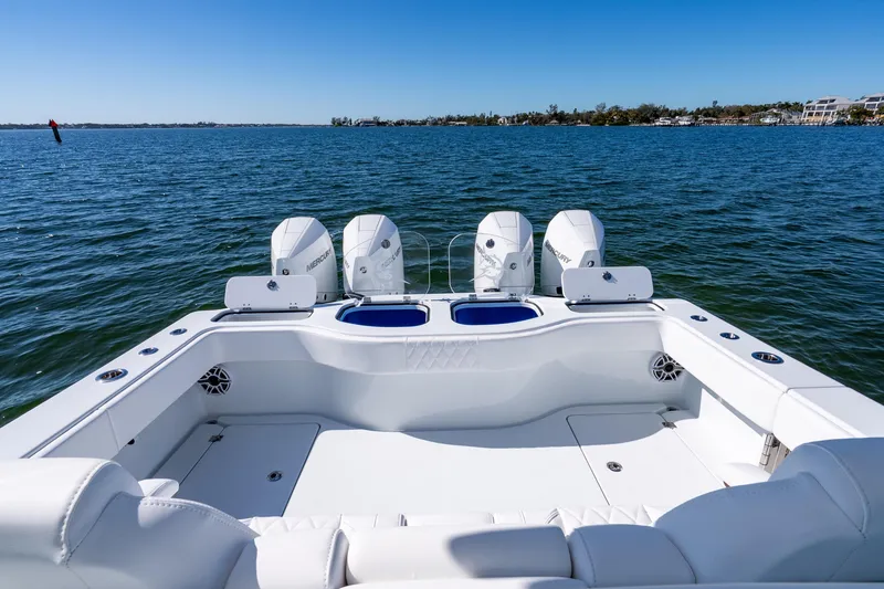 Slide: The Image of Freeman 35 boat, 2026 model, with triple Mercury engines on open water. - 40