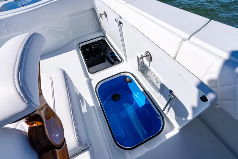 Slide: The Image of Open storage compartments on a 2026 Freeman 35 boat interior. - 41