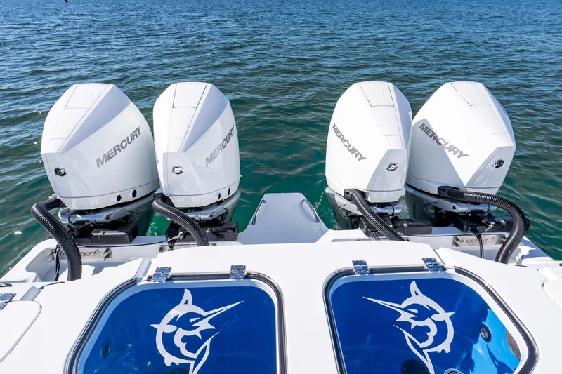 Slide: The Image of Four Mercury outboard engines on a 2026 Freeman 35 boat, with ocean backdrop. - 45