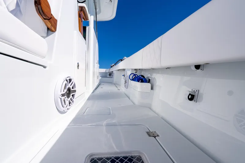 Slide: The Image of 2026 Freeman 35 boat deck with sleek white design and blue sky background. - 47