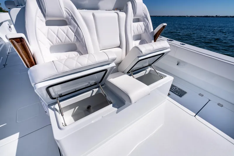 Slide: The Image of Luxurious seating on a 2026 Freeman 35 boat with storage compartments, overlooking the ocean. - 49