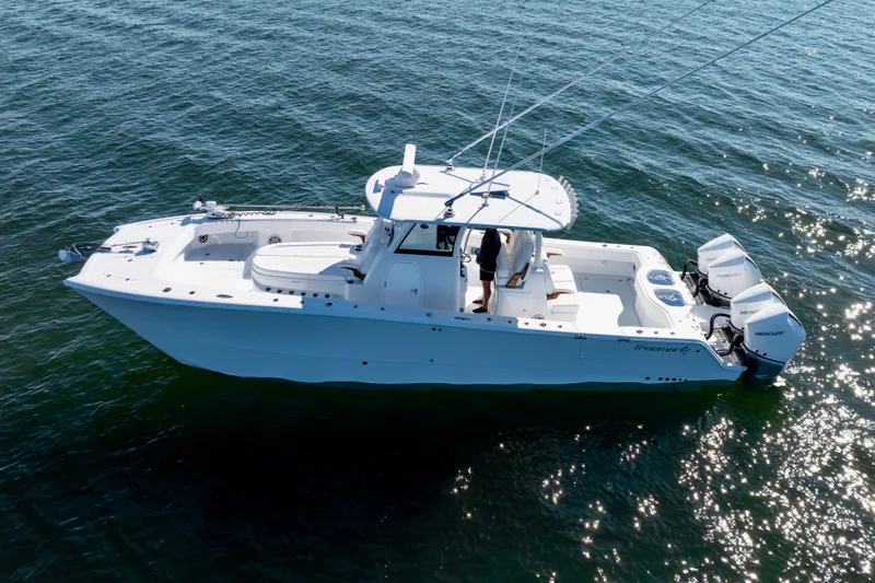 Slide: The Image of 2026 Freeman 35 boat on water, featuring twin Mercury engines. - 6