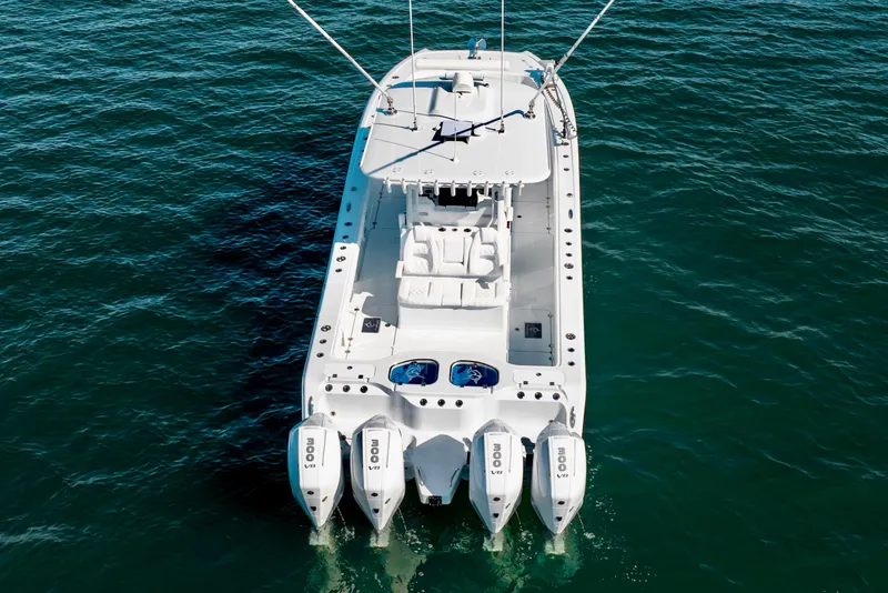 Slide: The Image of 2026 Freeman 35 boat with four engines on open water. - 9