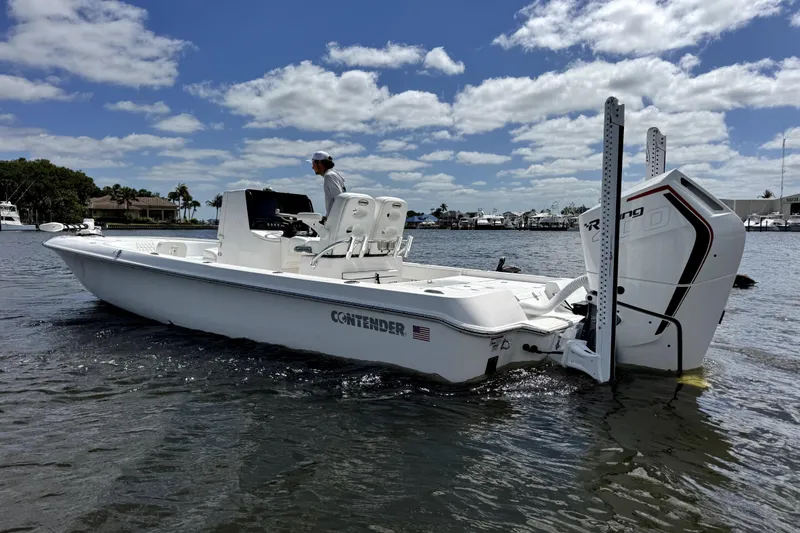 The Image of 2024 Contender 26 Bay boat on water, featuring sleek design and powerful engine. - 0