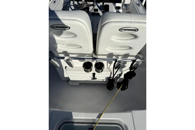 Slide: The Image of 2024 Contender 25 Bay boat interior with rod holders and seating. - 21