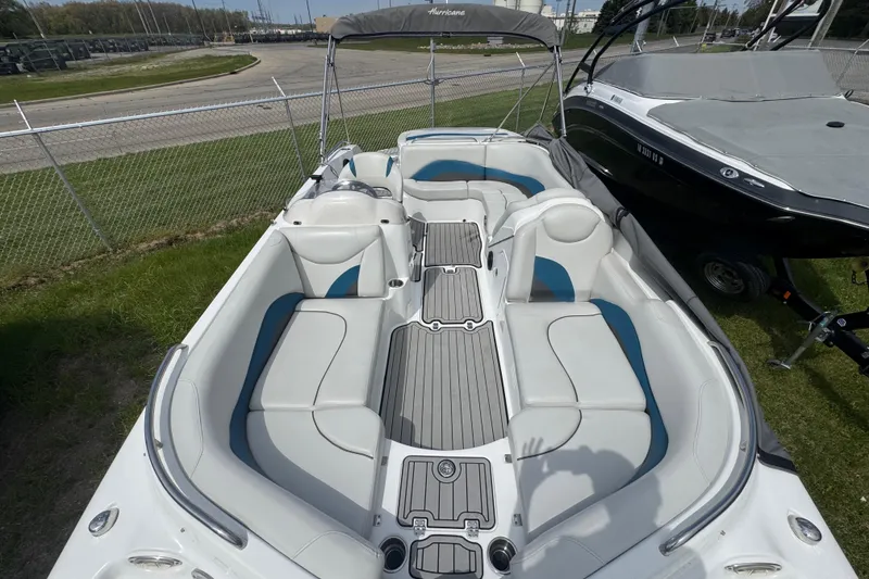 Slide: The Image of 2019 Hurricane SunDeck Sport 202 IO boat with spacious seating and sleek design. - 10
