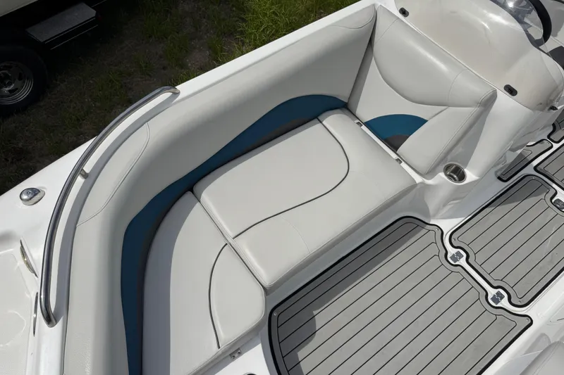 Slide: The Image of 2019 Hurricane SunDeck Sport 202 IO boat interior with cushioned seating and sleek design. - 11