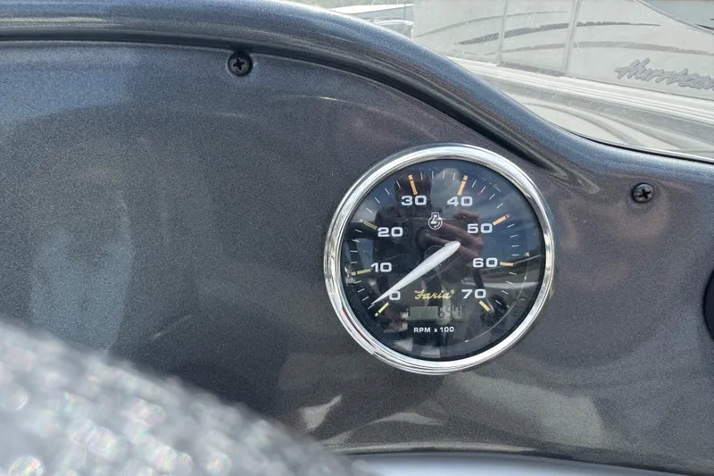 Slide: The Image of Close-up of a 2019 Hurricane SunDeck Sport 202 IO boat tachometer. - 17
