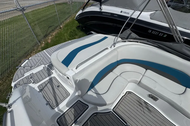 Slide: The Image of 2019 Hurricane SunDeck Sport 202 IO boat interior with blue and white seating. - 23