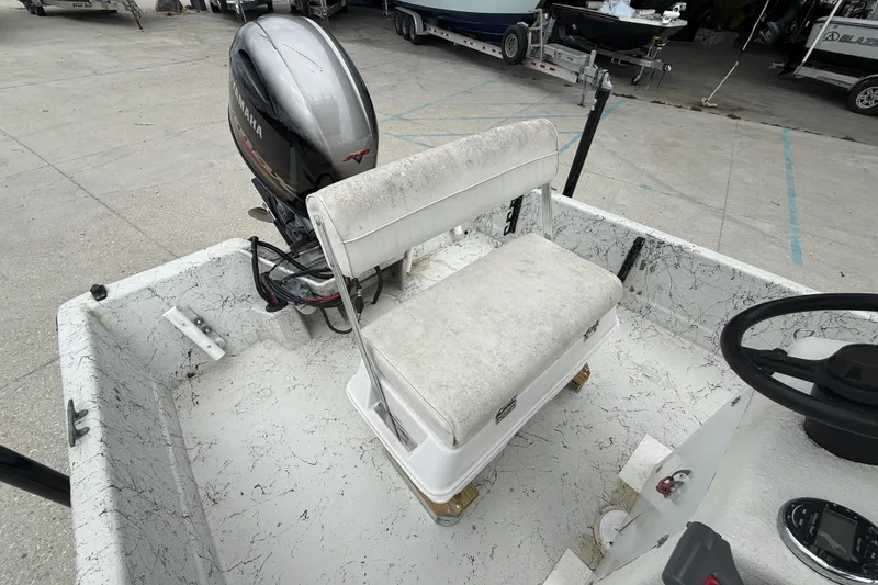 Slide: The Image of 1991 Avenger 210 Bay Runner boat interior with Yamaha outboard motor. - 12