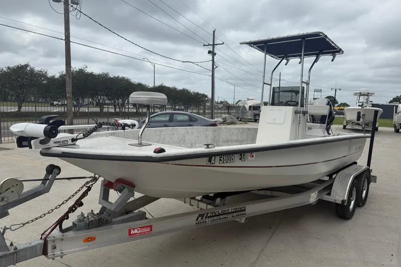 Slide: The Image of 1991 Avenger 210 Bay Runner boat on trailer, equipped with Minn Kota trolling motor. - 3