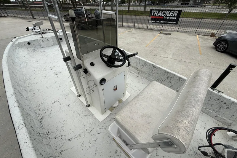 Slide: The Image of 1991 Avenger 210 Bay Runner boat interior with steering console and seating. - 8