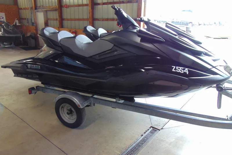 The Image of 2021 Yamaha WaveRunner FX Cruiser SVHO on trailer in a garage setting. - 1
