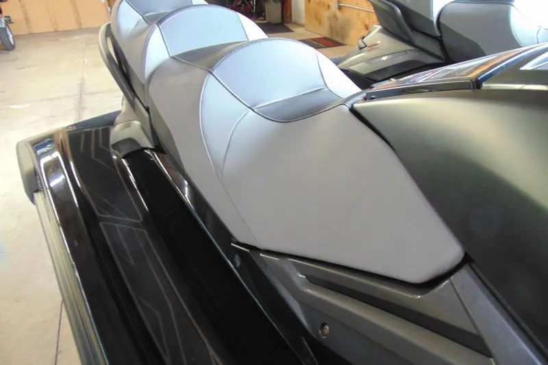 Slide: The Image of 2021 Yamaha WaveRunner FX Cruiser SVHO with sleek seating design in a garage setting. - 6