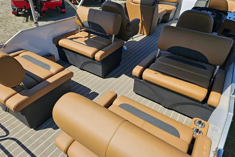 Slide: The Image of 2026 Bentley Pontoons Legacy 223 QSB interior with luxurious tan and black seating. - 12
