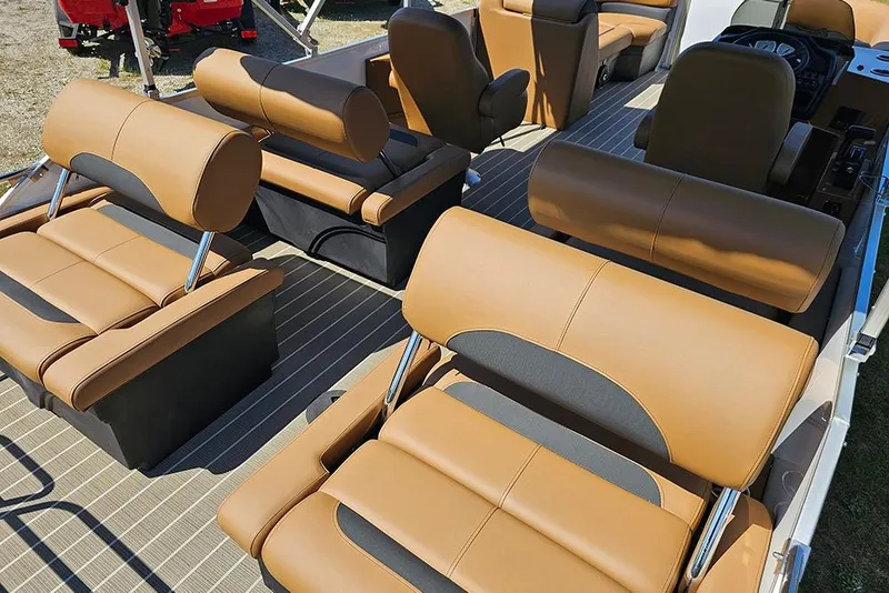 Slide: The Image of 2026 Bentley Pontoons Legacy 223 QSB interior with luxurious tan seating and modern design. - 15