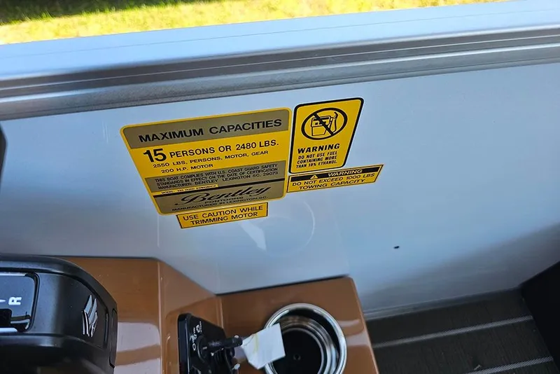 Slide: The Image of 2026 Bentley Pontoons Legacy 223 QSB capacity warning label, 15 persons or 2480 lbs. - 18