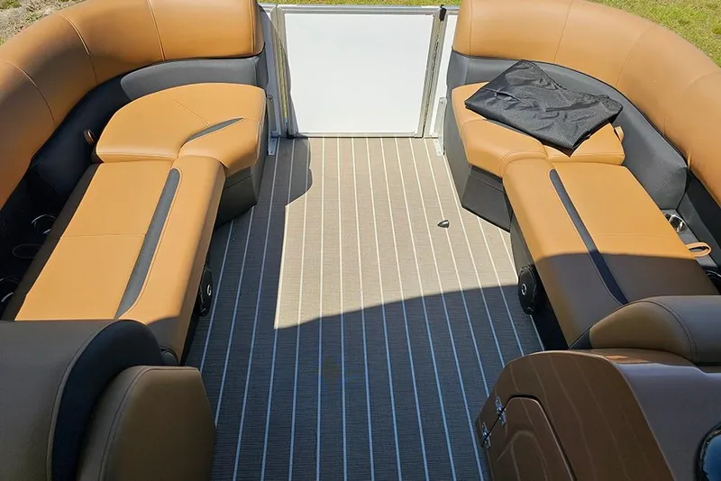 Slide: The Image of 2026 Bentley Pontoons Legacy 223 QSB interior with tan seating and striped flooring. - 20