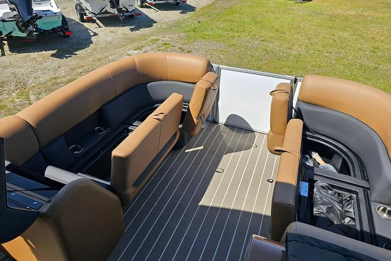 Slide: The Image of 2026 Bentley Pontoons Legacy 223 QSB interior with tan seating and striped flooring. - 21