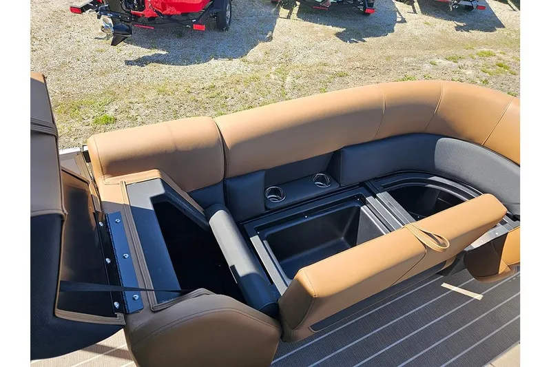 Slide: The Image of 2026 Bentley Pontoons Legacy 223 QSB interior with tan seating and storage compartments. - 22