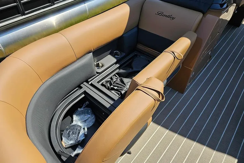 Slide: The Image of Luxurious seating on 2026 Bentley Pontoons Legacy 223 QSB with storage and cup holders. - 23