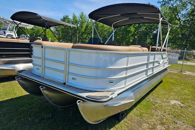 Slide: The Image of 2026 Bentley Pontoons Legacy 223 QSB pontoon boat with canopy, parked on grass. - 6