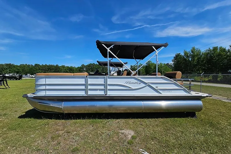 Slide: The Image of 2026 Bentley Pontoons Legacy 223 QSB on grass under clear blue sky. - 7