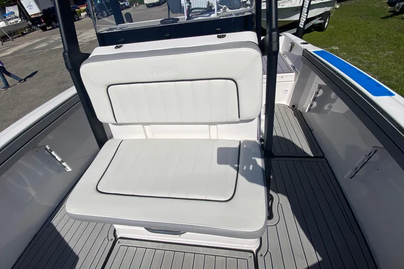 Slide: The Image of 2023 Yamaha Boats 195 FSH Sport interior with white seating and sleek design. - 4